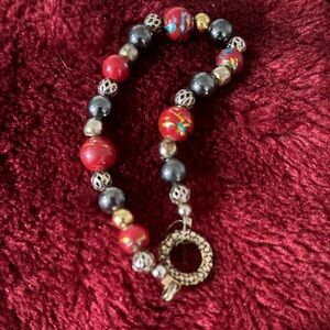 Red and Black Beaded Bracelet with Gold Accents